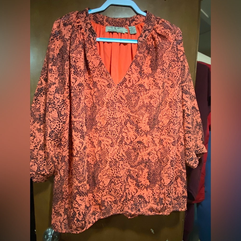 Coral color R. Cinco Ranch top.  Flowy and oversized.  Bell cuffed sleeves